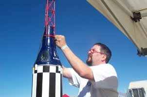 Tightening down the Tower hold down straps